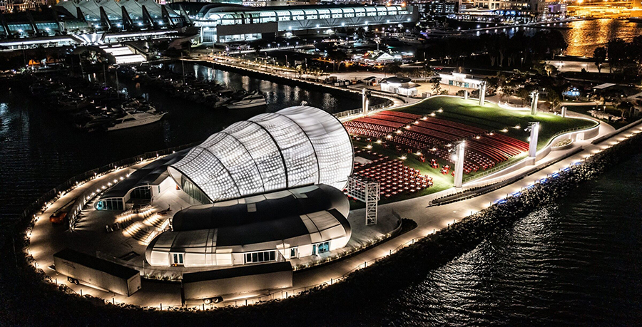 An image showing an outside stage next to a river