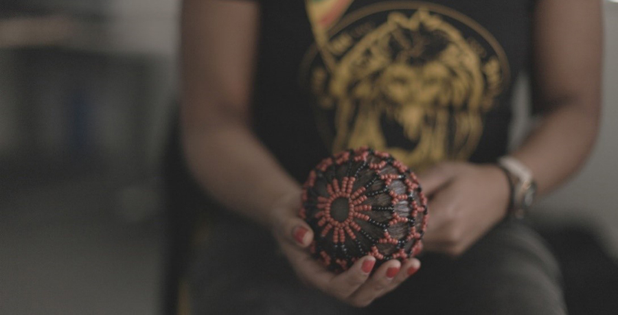 An image of someone holding a shaker instrument