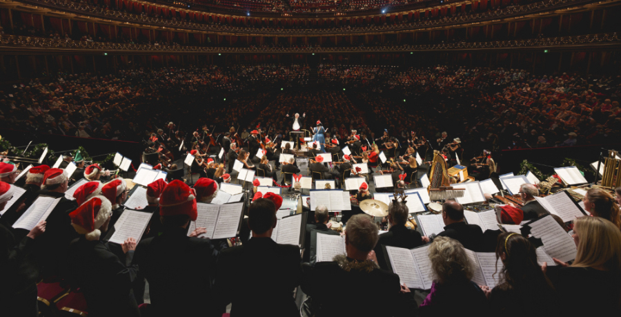 John Rutter conducting the Orchestra and a choir in a Christmas concert at the Royal Albert Hall