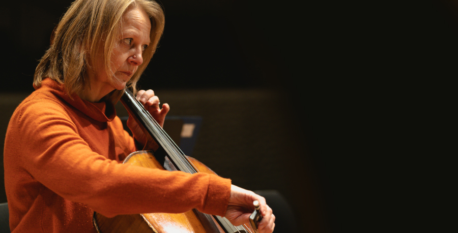 RPO Player Chantal Webster playing the cello in rehearsal.