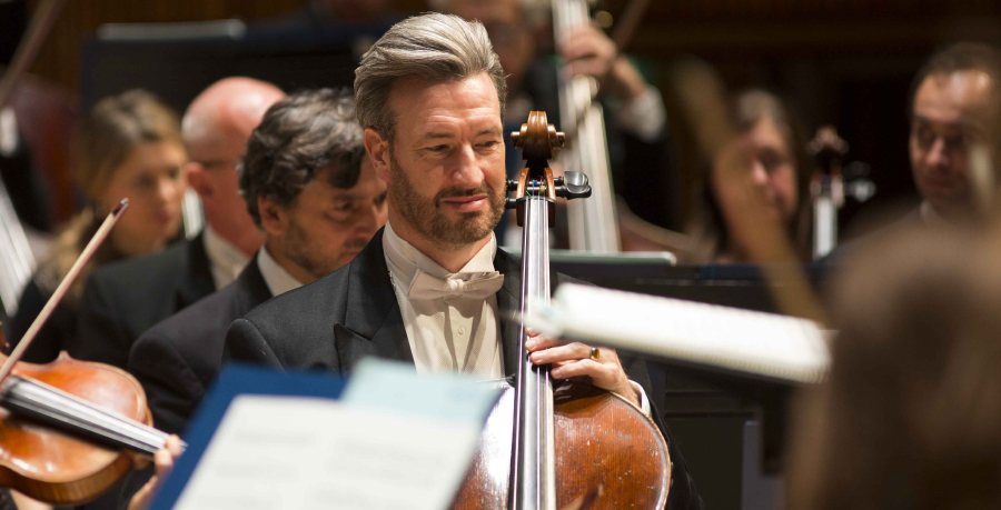 RPO Player Jonathan Ayling playing the cello in concert.