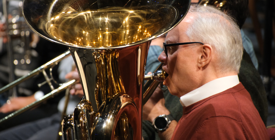 RPO Player Kevin Morgan playing the tuba in rehearsal.